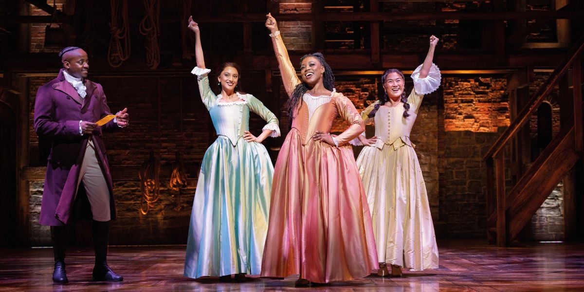 Hamilton production image. Yeukayi Ushe, Bente Mulan, Georgina Onuorah and Jasmine Jia Yung Shen as the Schuyler Sisters.