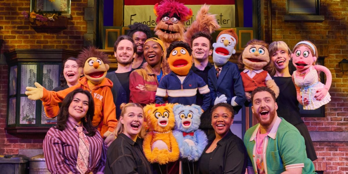 The full cast of Avenue Q posing for the camera. Photo by Matt Crockett.