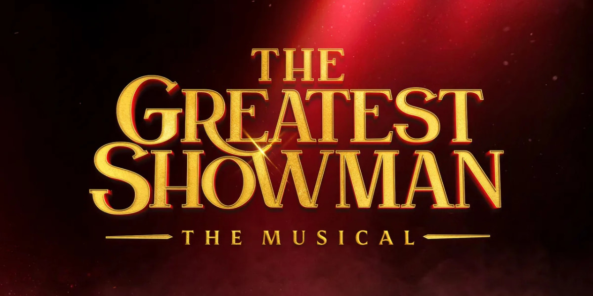 Show poster with The Greatest Showman gold lettering over a dark, dappled red background