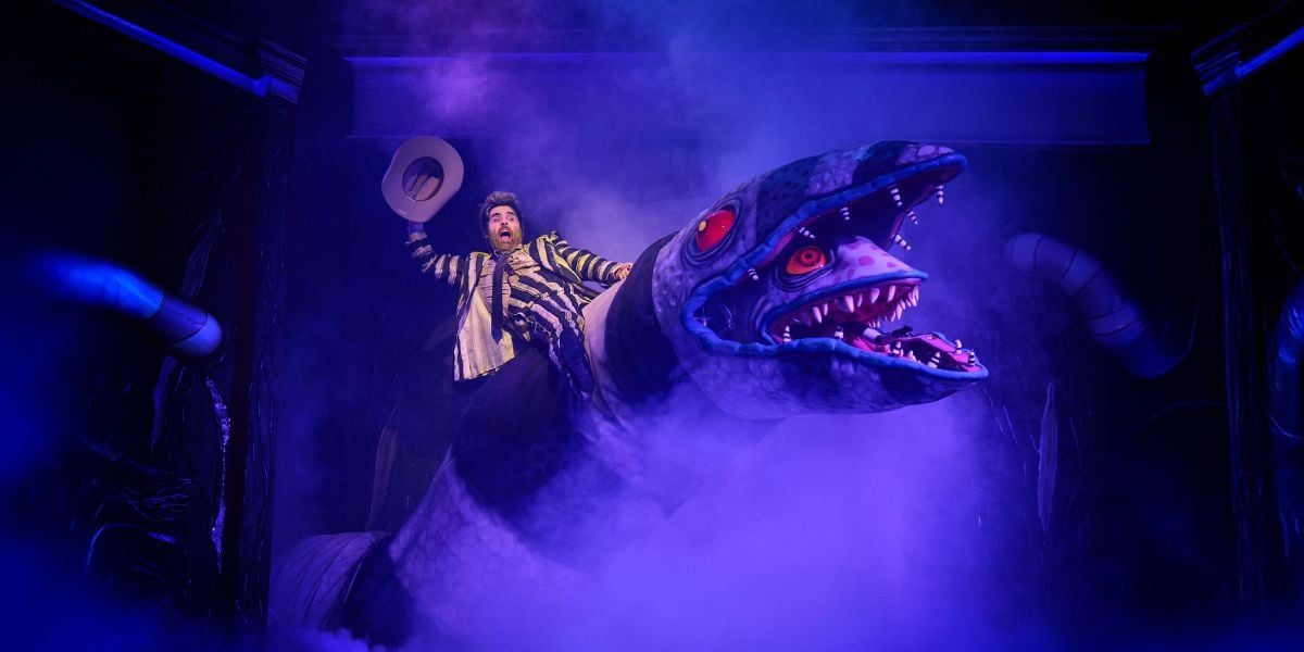 David Fynn as Beetlejuice in Beetlejuice the Musical West End riding a sandworm