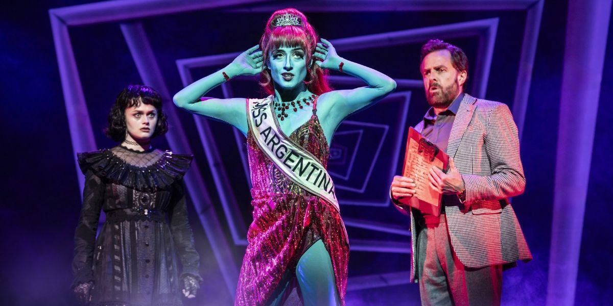 Hannah Nordberg as Lydia Deetz, Vanessa Aurora Sierra as  Miss Argentina and Alasdair Harvey as Charles Deetz in Beetlejuice, West End © Johan Persson