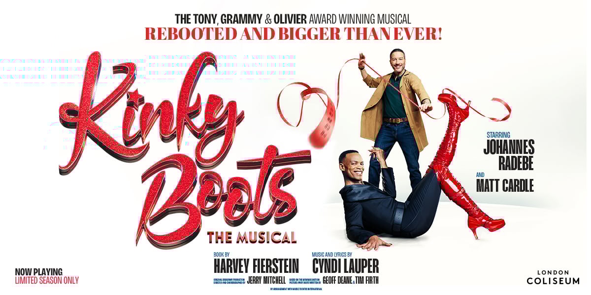 Johannes Radebe smiles at the camera, his knee high red boots are kicked out in front of him. Text reads: Kinky Boots