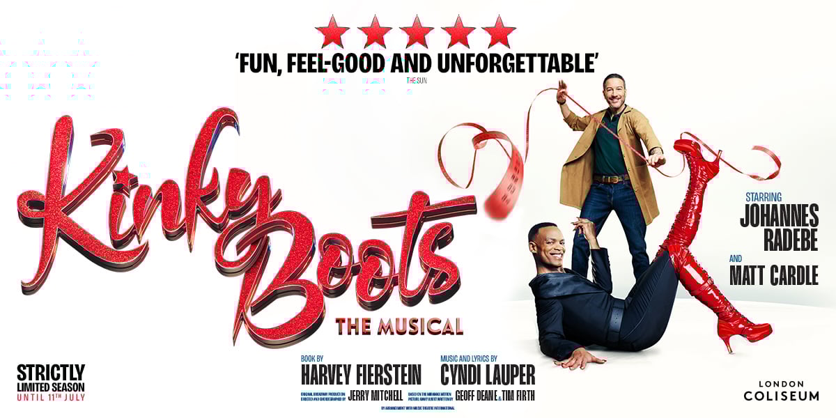 Johannes Radebe smiles at the camera, his knee high red boots are kicked out in front of him. Text reads: Kinky Boots